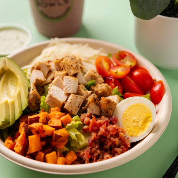 Bango Bowls grain bowl with roasted sweet potatoes, avocado, tomatoes, and egg