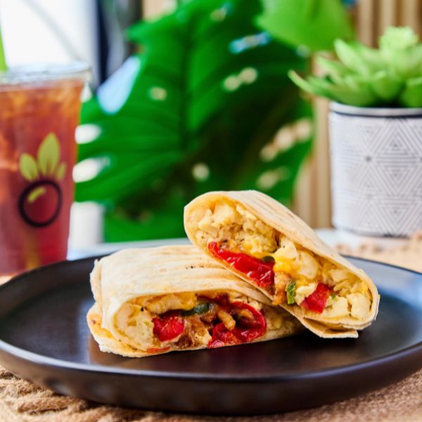 Bango Bowls breakfast wrap on a dark plate with a Bango drink