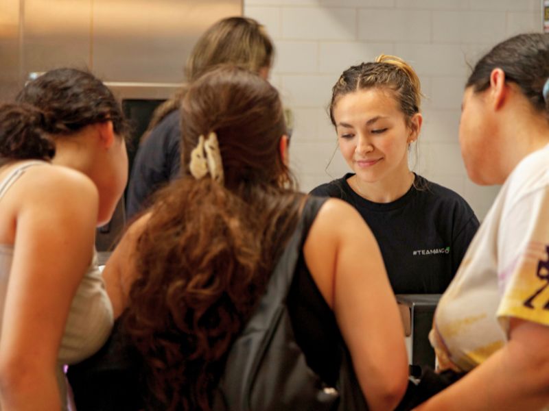 Bango Bowls team member serving guests at a Bango location